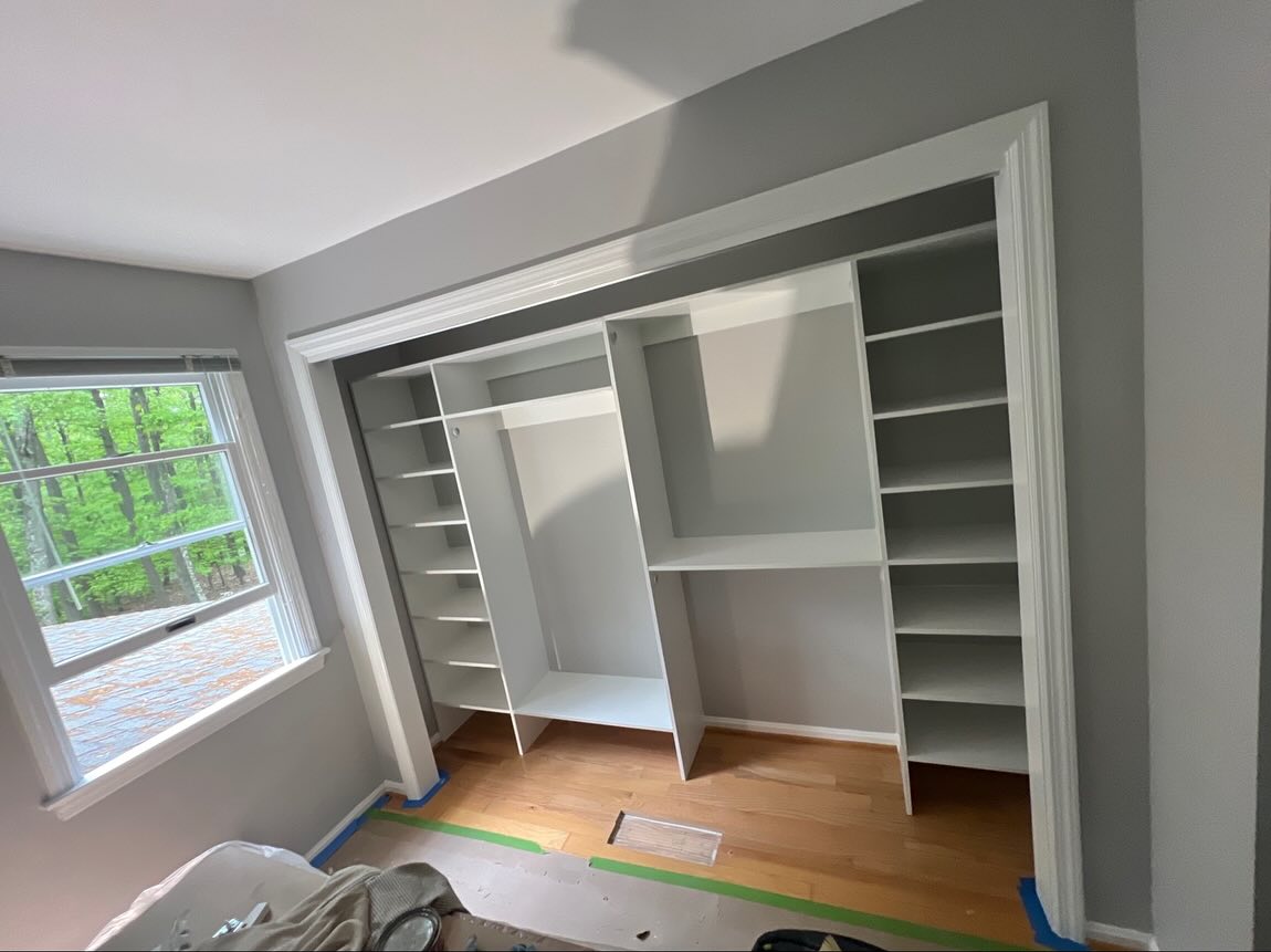 Master bedroom upgrade with custom built-in closet, shelving, and sliding doors