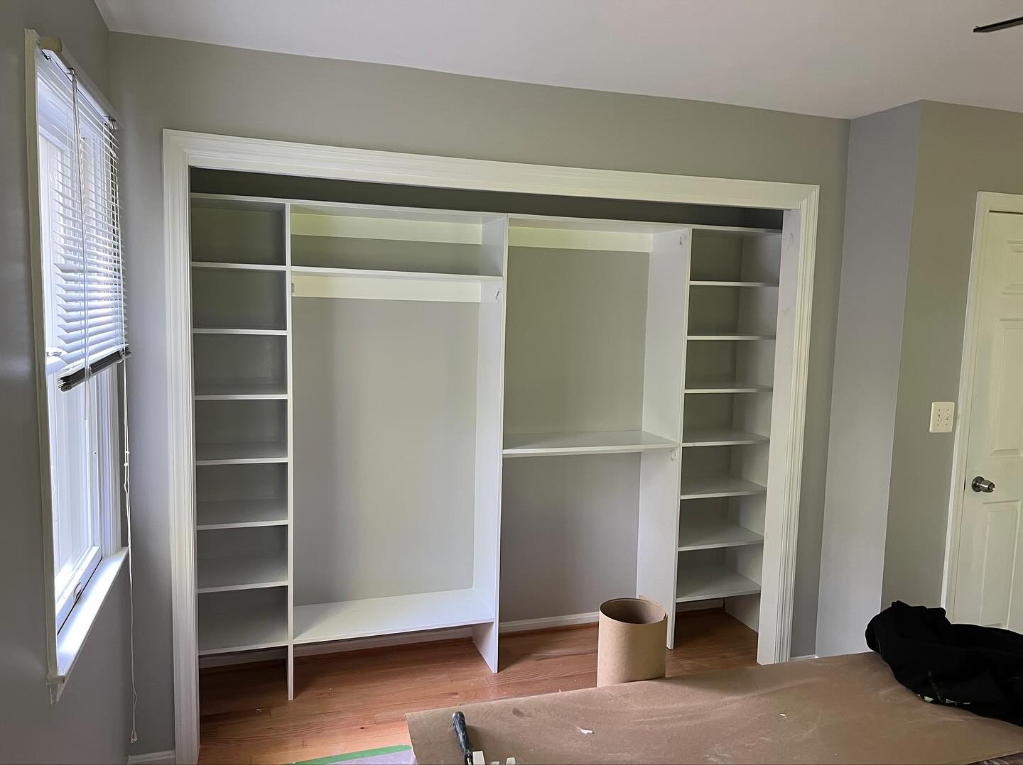 Master bedroom upgrade with custom built-in closet, shelving, and sliding doors